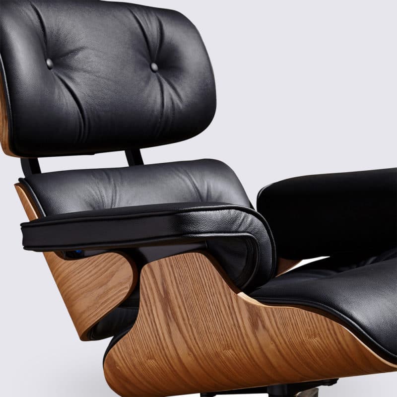 assise comfortable copie fauteuil charles eames avec ottoman cuir pleine fleur noir bois de frêne base alu noir